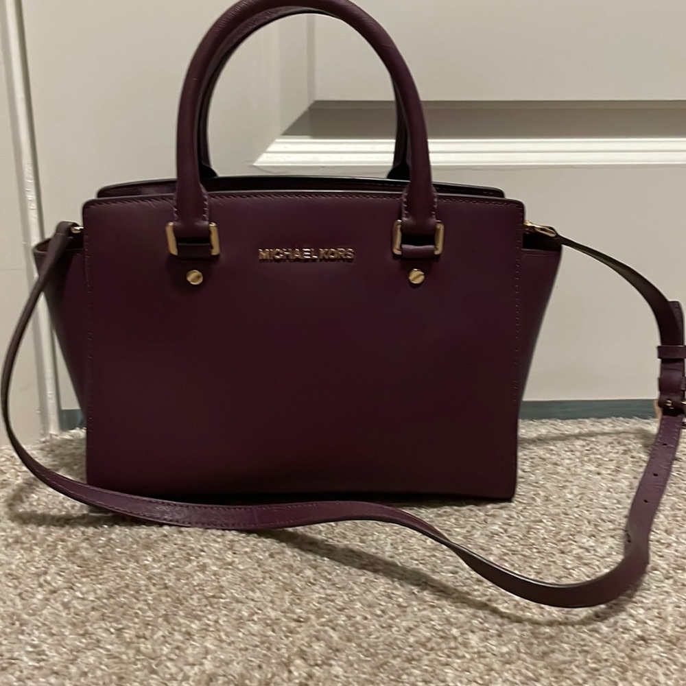 Dark purple Micheal Kors crossbody purse. Authentic